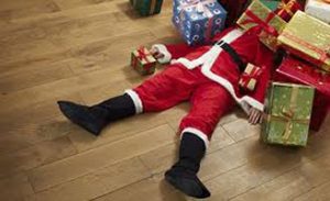 Santa Lying Under Presents