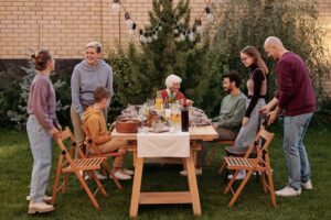 Family around outdoor picnic table image