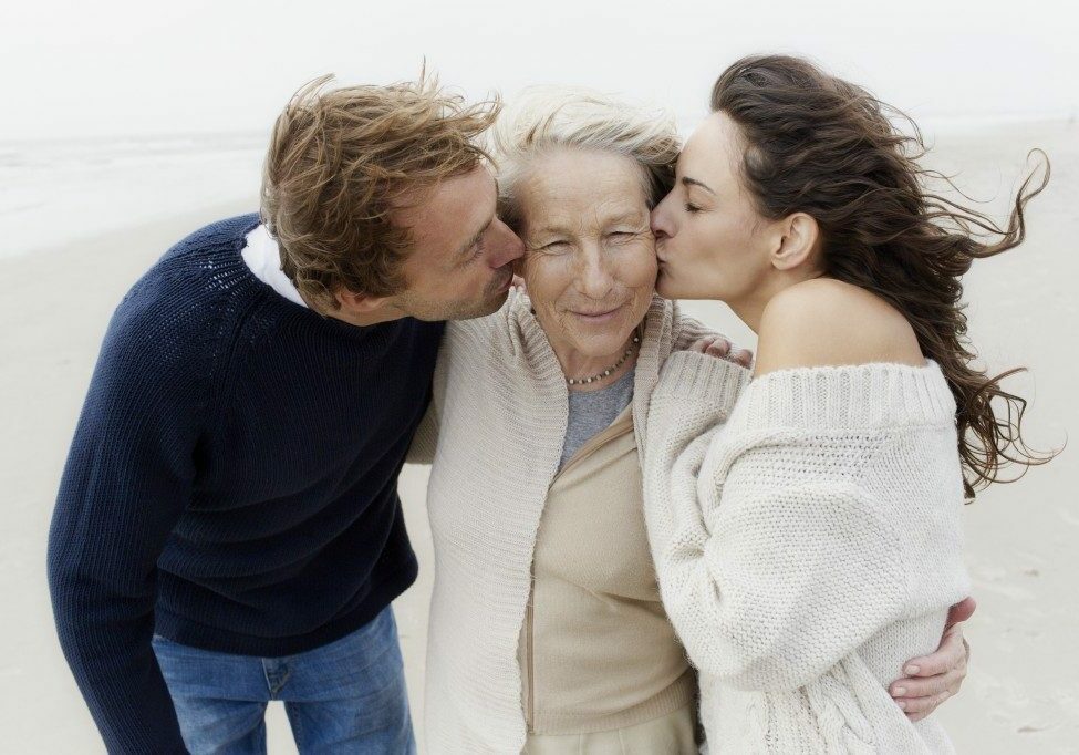 Son and Daughter Kissing Mom on Cheek